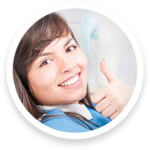 Patient smiles while receiving Invisalign treatment with clear aligners applied.